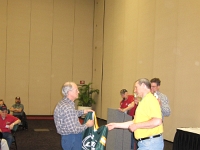 Rob hands over the grand prize of the night